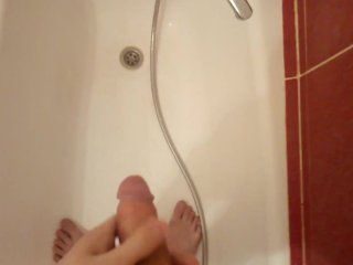 Teen pees in the tub and touches cock