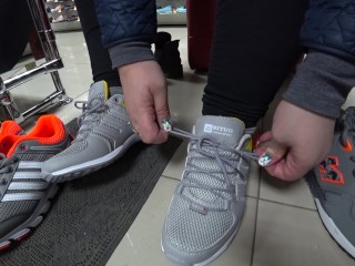 Foot Fetish in a Public Shoe Store. Fat Legs try on Sneakers.