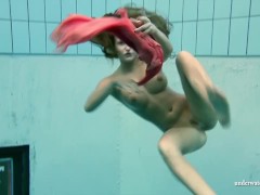 Big tits Silvie swims and shows hairy pussy