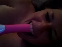 Horny slut deep throats her vibrator