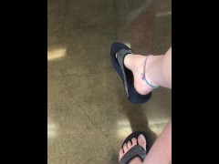 Teasing My mechanic with my stinky feet and dangling flip flop!