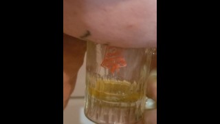 Bbw encouraged to pee more into glass