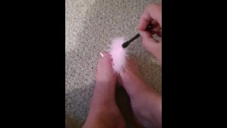 Rubbing my feet with feathers