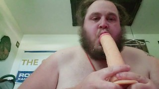 Deepthroating a massive cock