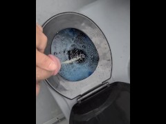 Taking a piss in the portapotty