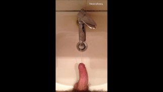 Peeing into wash basin in public restroom