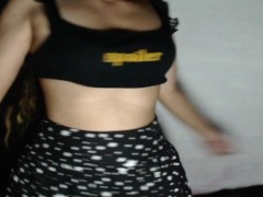 Kneeling in bed tossing hair