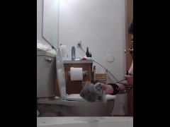 chained slave cleans toilet