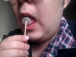 Gay teen licks and eats a lollipop made of his own cum