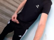 Preview 3 of A guy in sweatpants masturbates a big dick in the entrance