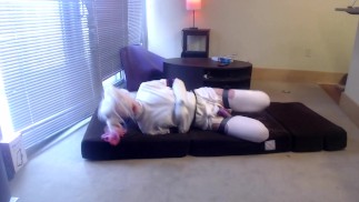 Plugged, caged & gagged sissy in selfbondage straitjacket and Harley Quinn wig