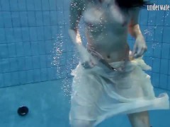 Dark haired teen Andrea in the pool