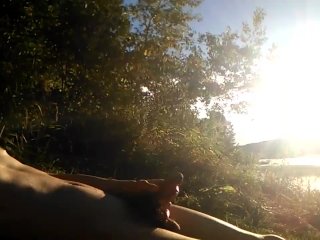 Natural teen boy lays nude by the river, wanks his hairy cock, squirts cum and relaxes during summer