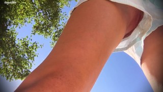 Up skirt. girl in short shorts without panties. Pussy close-up. camera in the Park