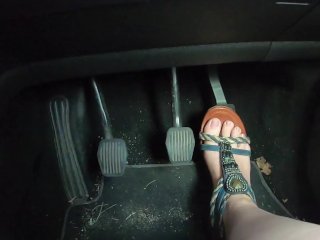 Racy seductive feet driving in revealing sandals