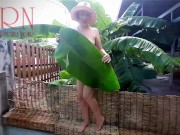 Preview 1 of Rural striptease. Country girl dancing in the yard of her house  Rustic striptease with banana leaf