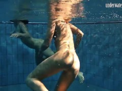 Girls Andrea and Monica stripping one another underwater