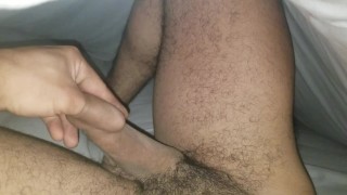 Sliding thumb and forefinger around under foreskin
