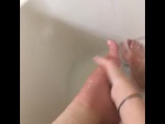 Girl washing sore feet and ankles after working long shift