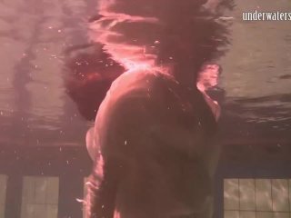 Brunette teen_Kristina Andreeva swims naked in the_pool