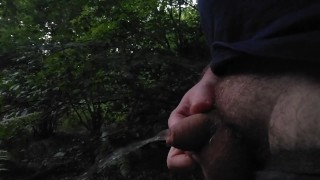 Short dick pissing in the forest