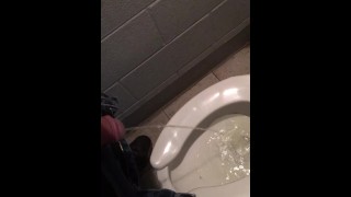 slave peeing in public toilet
