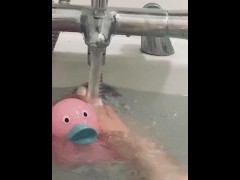 My feet in the bath playing with my rubber duck 