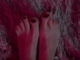 pretty long feet with red painted toenails