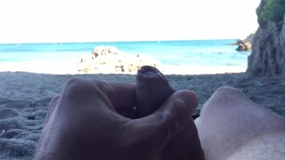 Slow motion cumshot on public beach