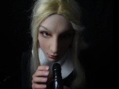 Nun in female mask practices blowjob on strapon