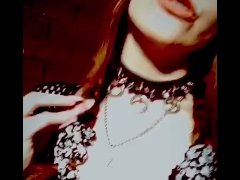 Goth stripper with fangs smoking