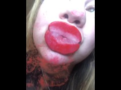Red lips kissing glass