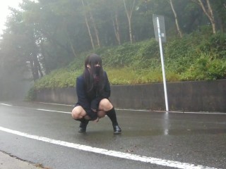 Transgender honoka peeing openly in the center of the road.