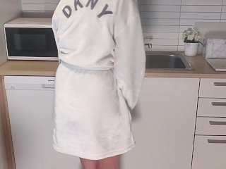 Desperate girl has to pee while washing dishes