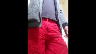Pissss in toilet wearing red shorts