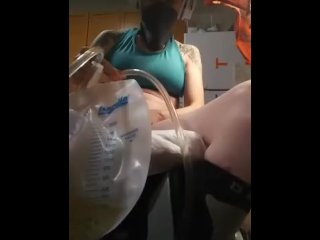 Sexy girl in wheelchair inserts 16 in catheter dripping in Lube into a 2000ml night bag. ENJOY 