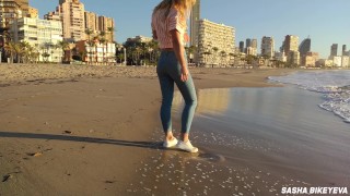 Wet shoot on a public beach with Crazy Model. Risky outdoor masturbation. Foot fetish. Pee in jeans