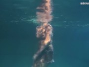 Preview 2 of Dressed underwater beauty Bulava Lozhkova swimming naked