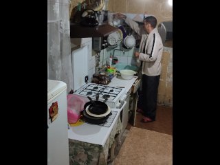 vertical video, solo male, kitchen, evening