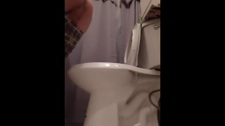 Sexy guy pissing then spreads ass open