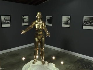 solo female, bodypainted, gold statue freeze, gold bodypainting