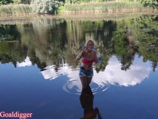 Girl in Glasses Blowing Bubbles on the River. Full Clip in Fan Club