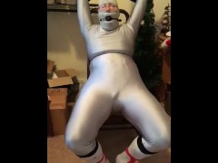 Self bondage :  belt to chair, gagged, and handcuffed wearing spandex. 