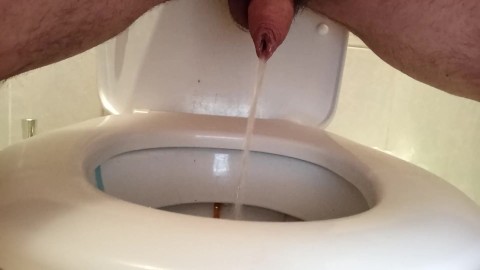 Peeing in a dirty public toilet. Uncut dick with a lot of foreskin