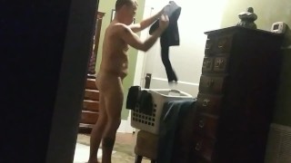 Naked cleaning the house