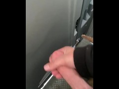 Stroking in a construction porta potty. 