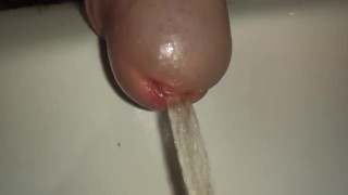 Pissing cock, extreme close up