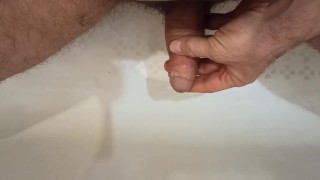Pissing, spiting on the dickhead and jerk off in the bathroom.