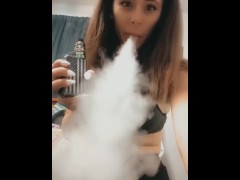 Vaping in bra and leggings