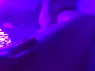 Washing her cheeks in the bath with a blacklight